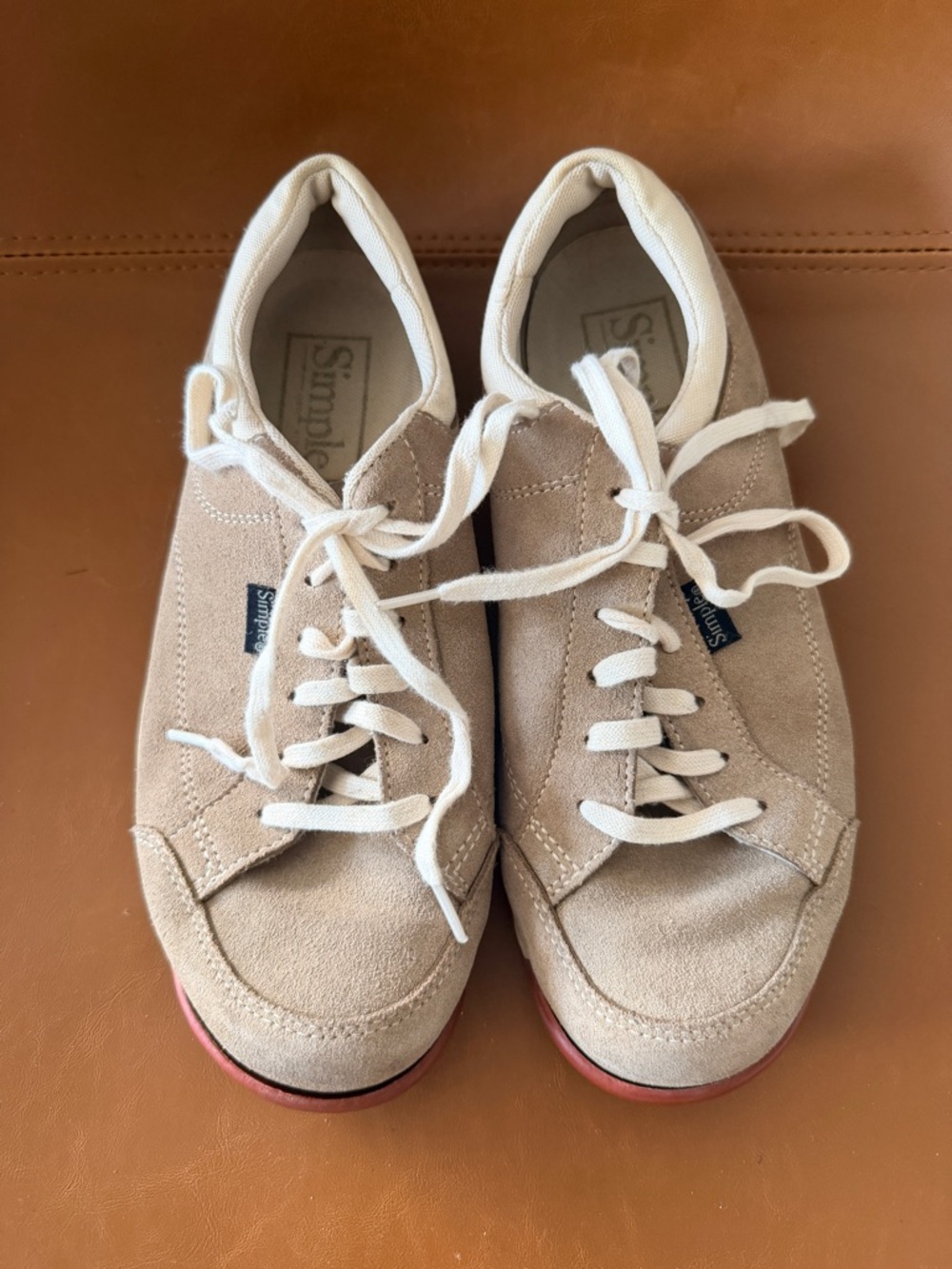 Simple Beige Suede Sneakers with Ivory Trim and Red Outsole Accent